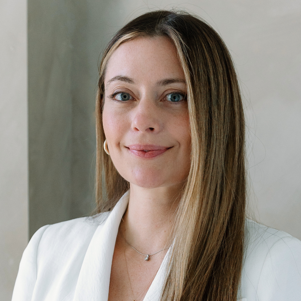 Portrait of Lindsey Woodward Rafkind, Co-CIO of Abacus, smiling warmly