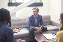 Spencer Sherman in a meeting at Abacus Wealth Partners